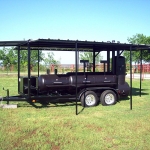 large smoker/grill on trailer with roof awning
