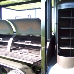 racks inside of large smoker/grill on trailer