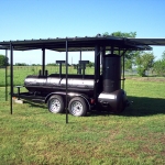 large smoker/grill on trailer with roof and awning