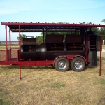 large bbq pit on trailer with roof and awning