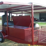 large bbq pit on trailer with roof and awning