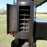 large dual grill on trailer with roof