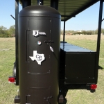 large dual grill on trailer with roof