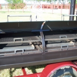 racks inside of meduim bbq pit on trailer