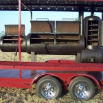 racks inside of meduim bbq pit on covered trailer